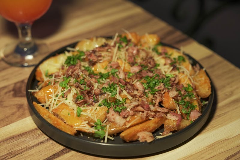 Loaded potato wedges with cheese and bacon